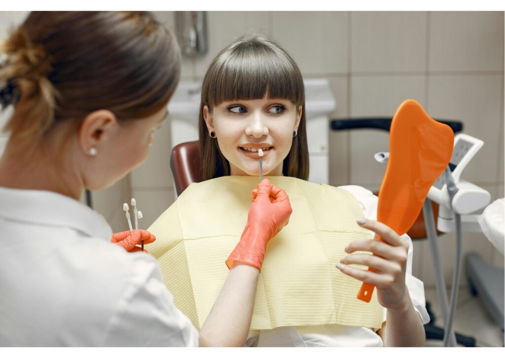 Patient reviewing dental implant tooth shade options during a cosmetic dentistry consultation