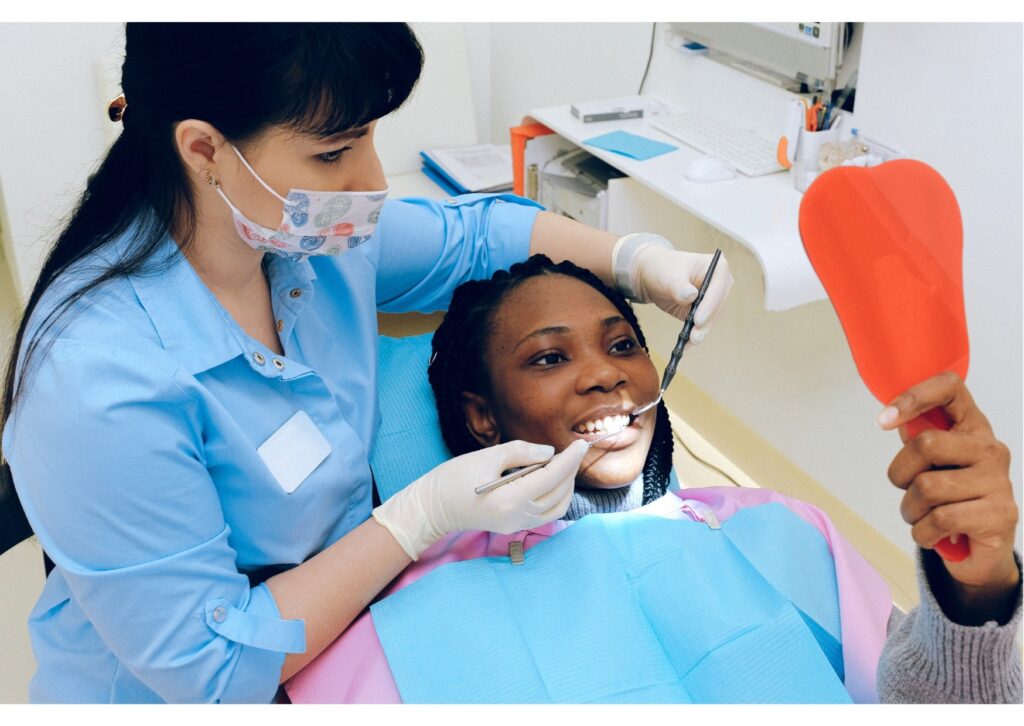 Patient reviewing dental implant results during a consultation about the benefits and drawbacks of dental implants